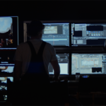 Filmmakers watching monitors on virtual production set