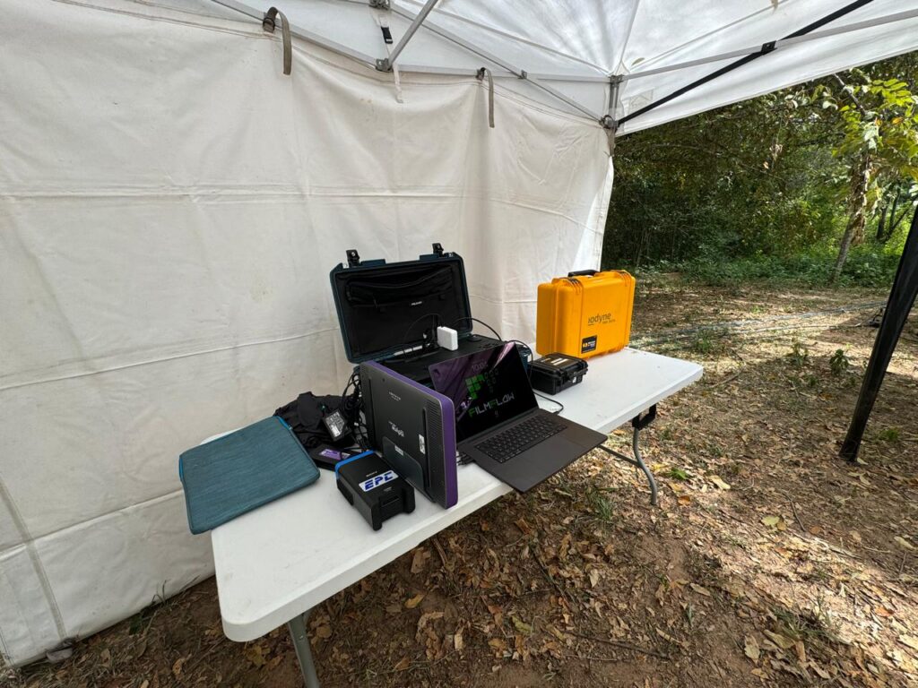 DIT station in remote camp with iodyne Pro Data storage device on location shoot